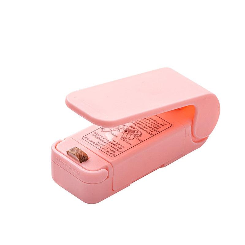 Mini selador de embalagem - Izzy Shopping